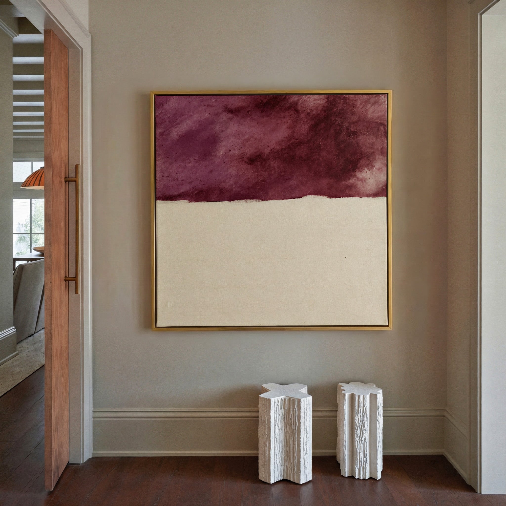 deep plum and cream abstract canvas wall art in a gold frame in a styled room setting