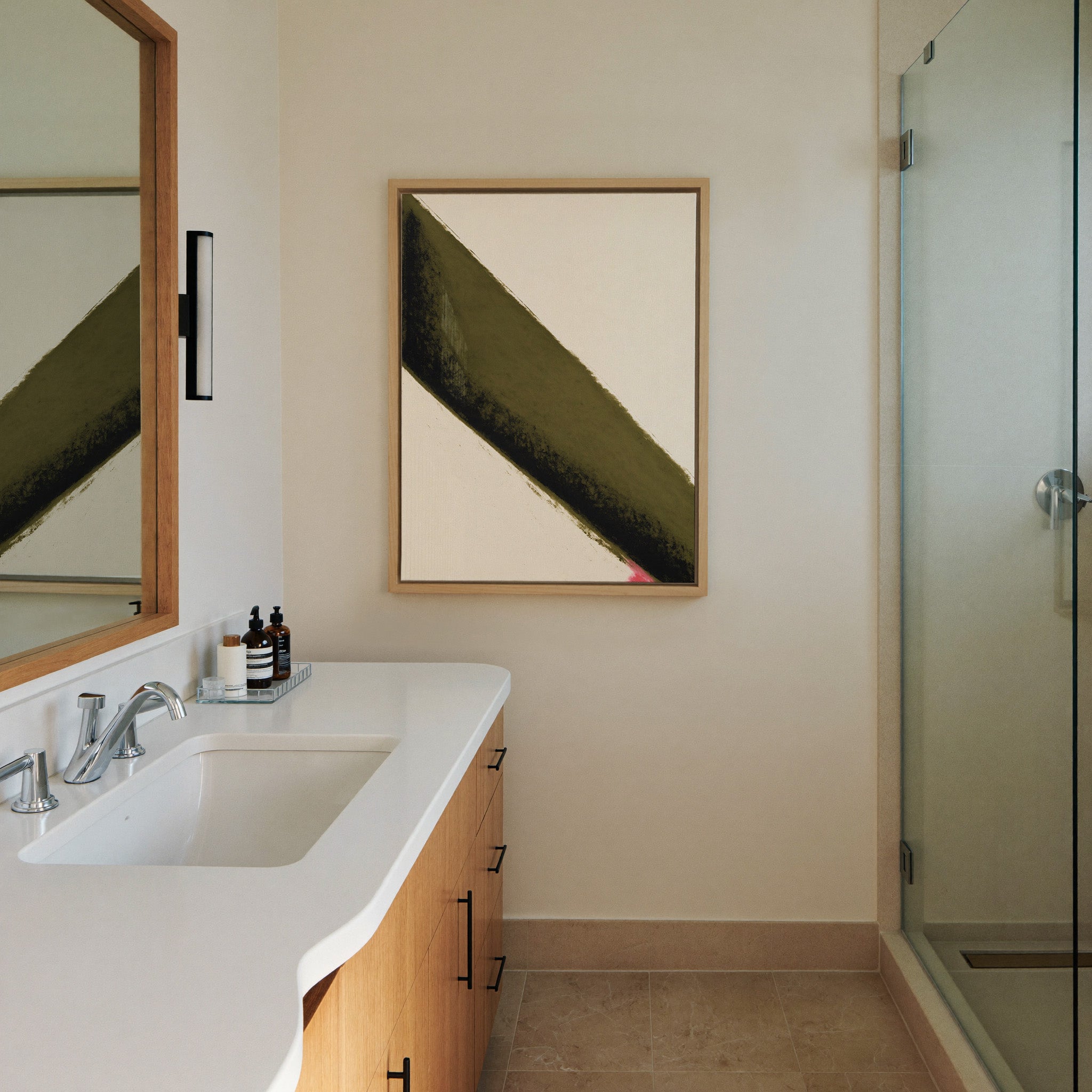 olive green diagonal band with black edge and canvas wall art in a natural wood frame in a styled room setting