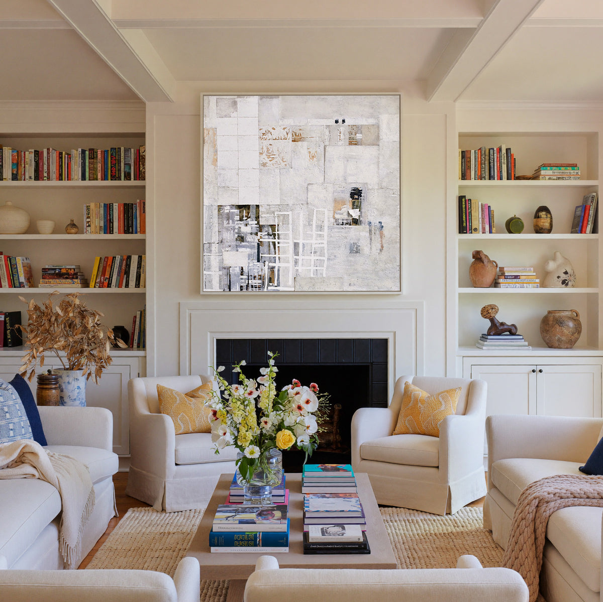 soft white and warm gray abstract with layered canvas wall art in a white frame above a fireplace