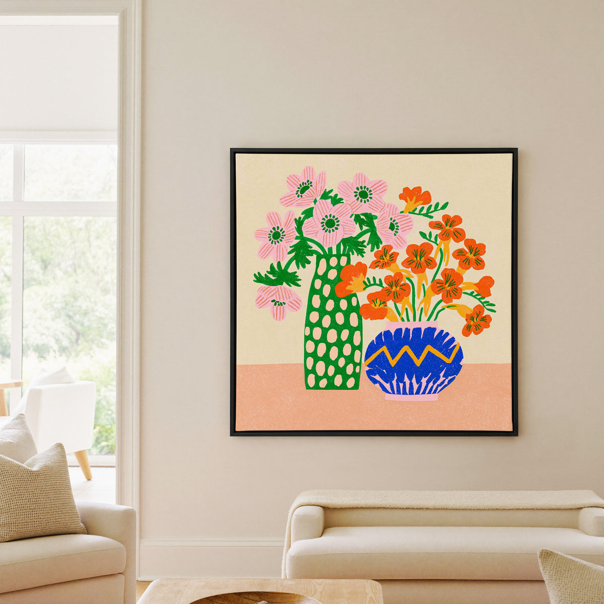 colorful folk still life with pink flowers, canvas wall art in a black frame in a living room