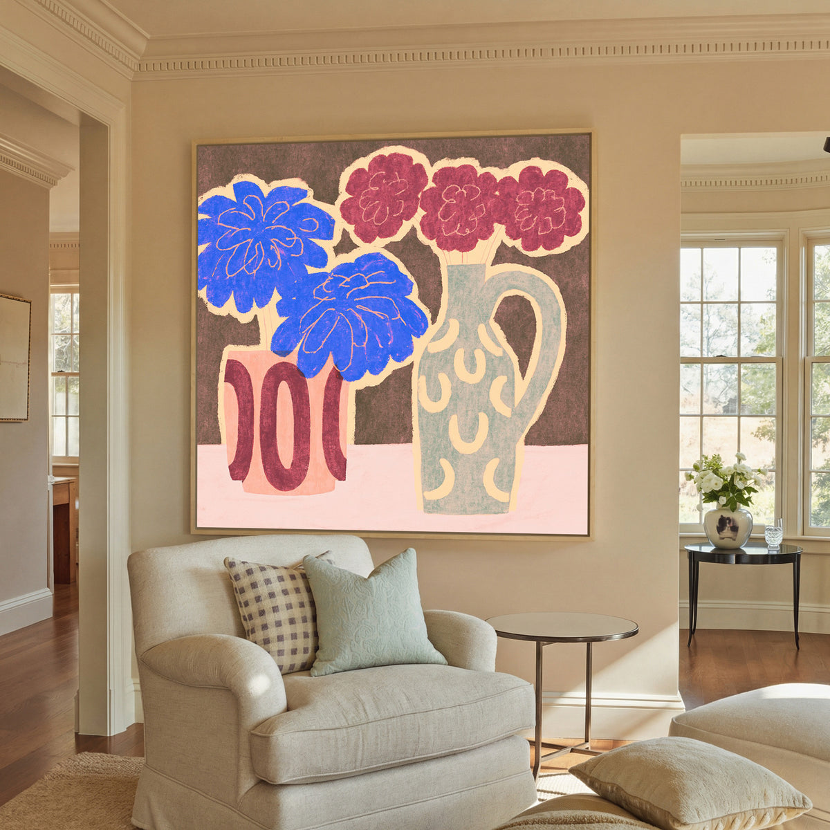 bold blue and burgundy flowers in patterned canvas wall art in a natural wood frame in a styled room setting