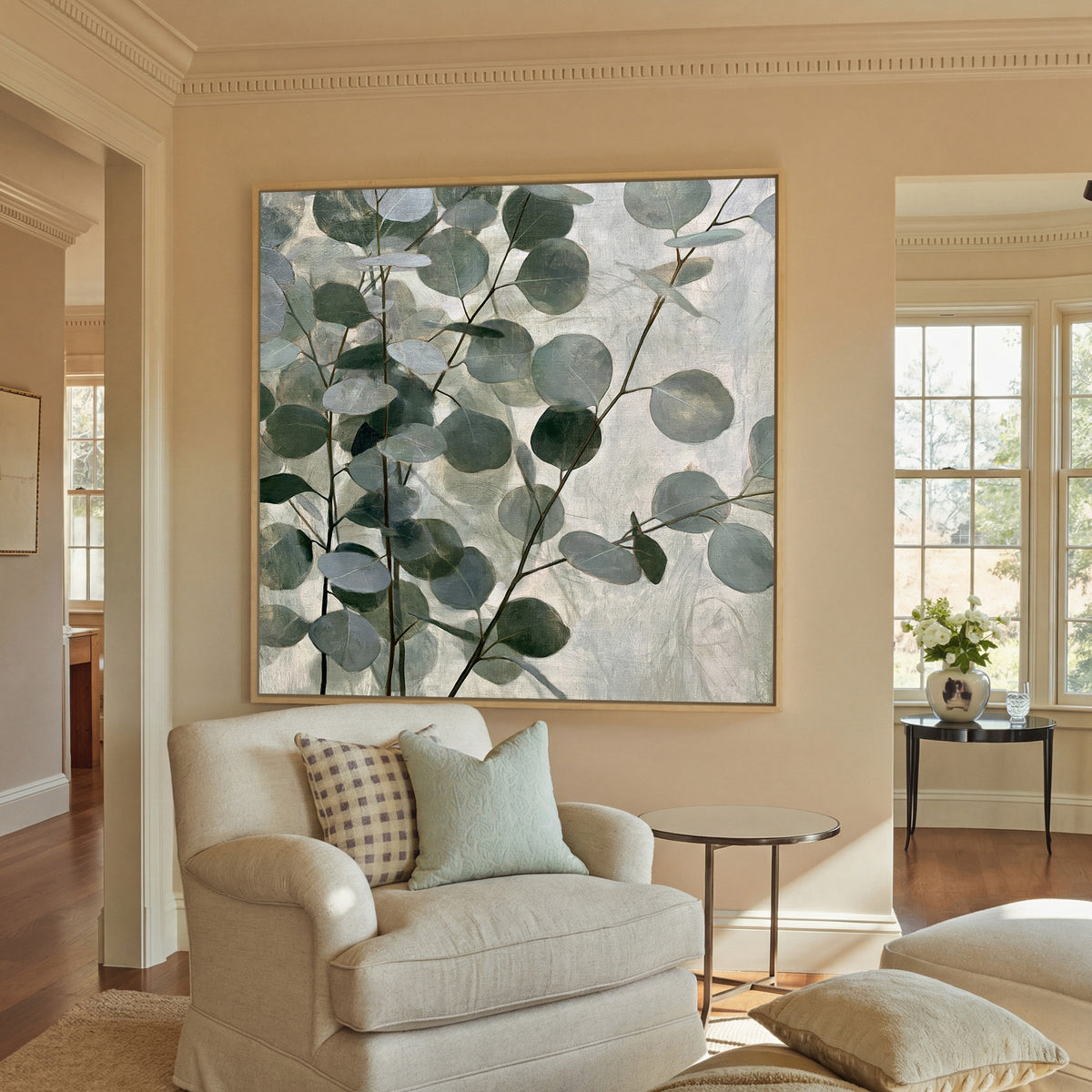 layered eucalyptus branches with rounded blue canvas wall art in a natural wood frame in a styled room setting