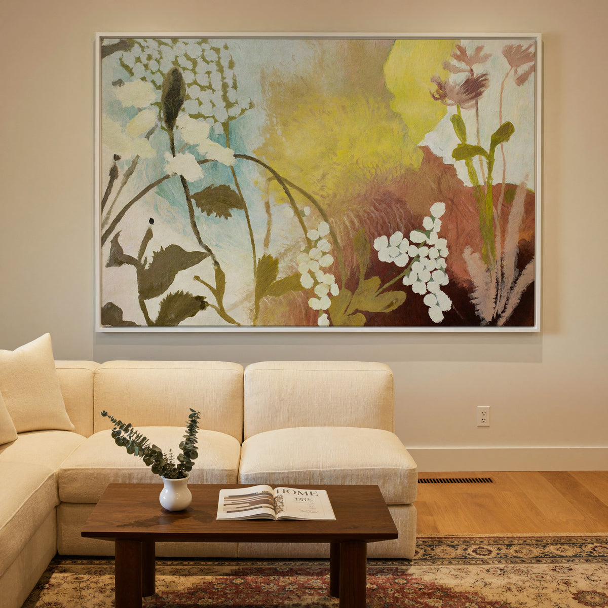 soft wildflower abstract with yellow, blush, canvas wall art in a white frame in a styled room setting