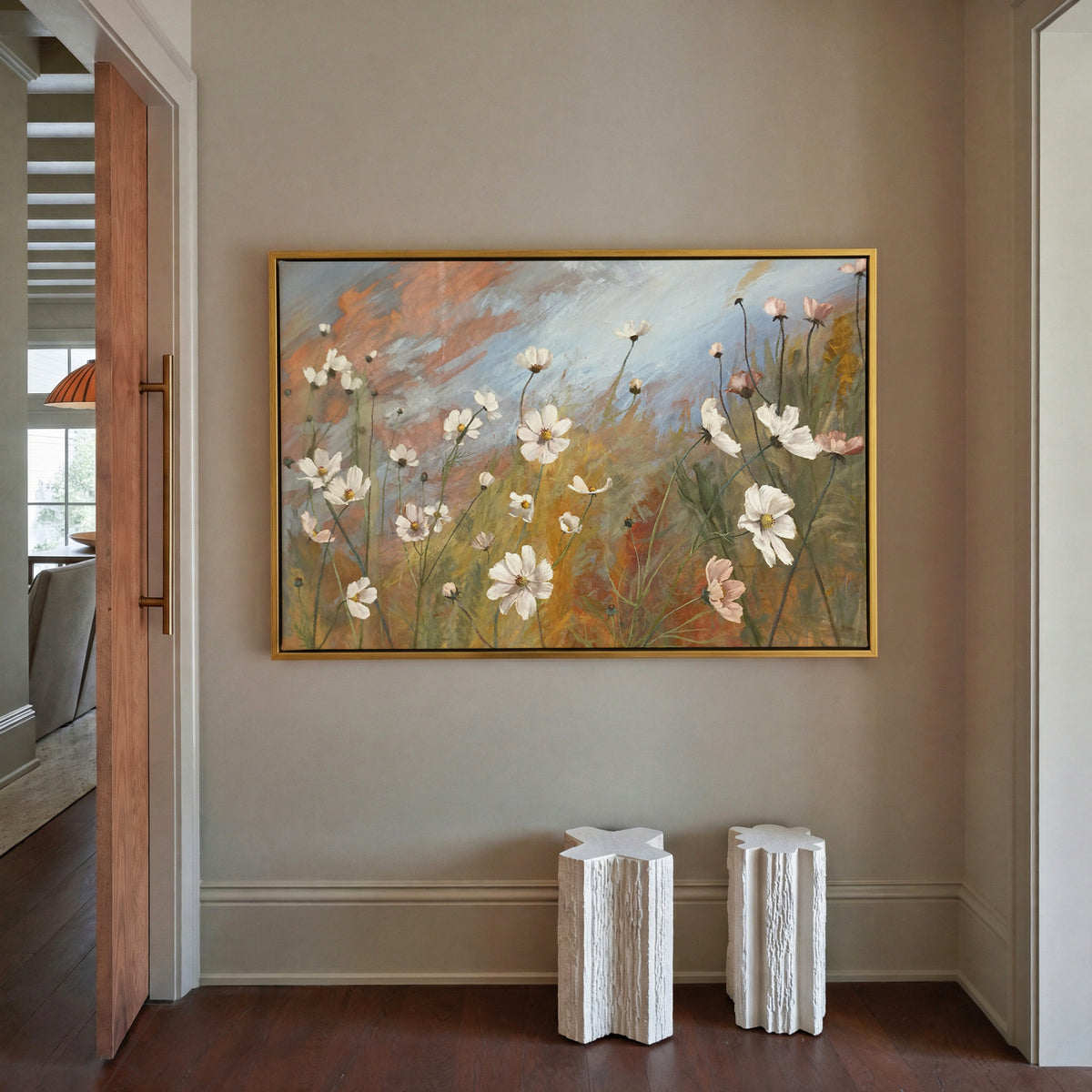 soft wildflower meadow with white and blush canvas wall art in a gold frame in a styled room setting