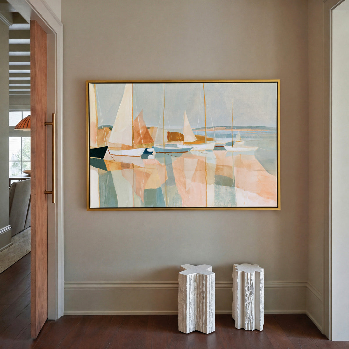 soft harbor with sailboats and pale reflections canvas wall art in a gold frame in a styled room setting