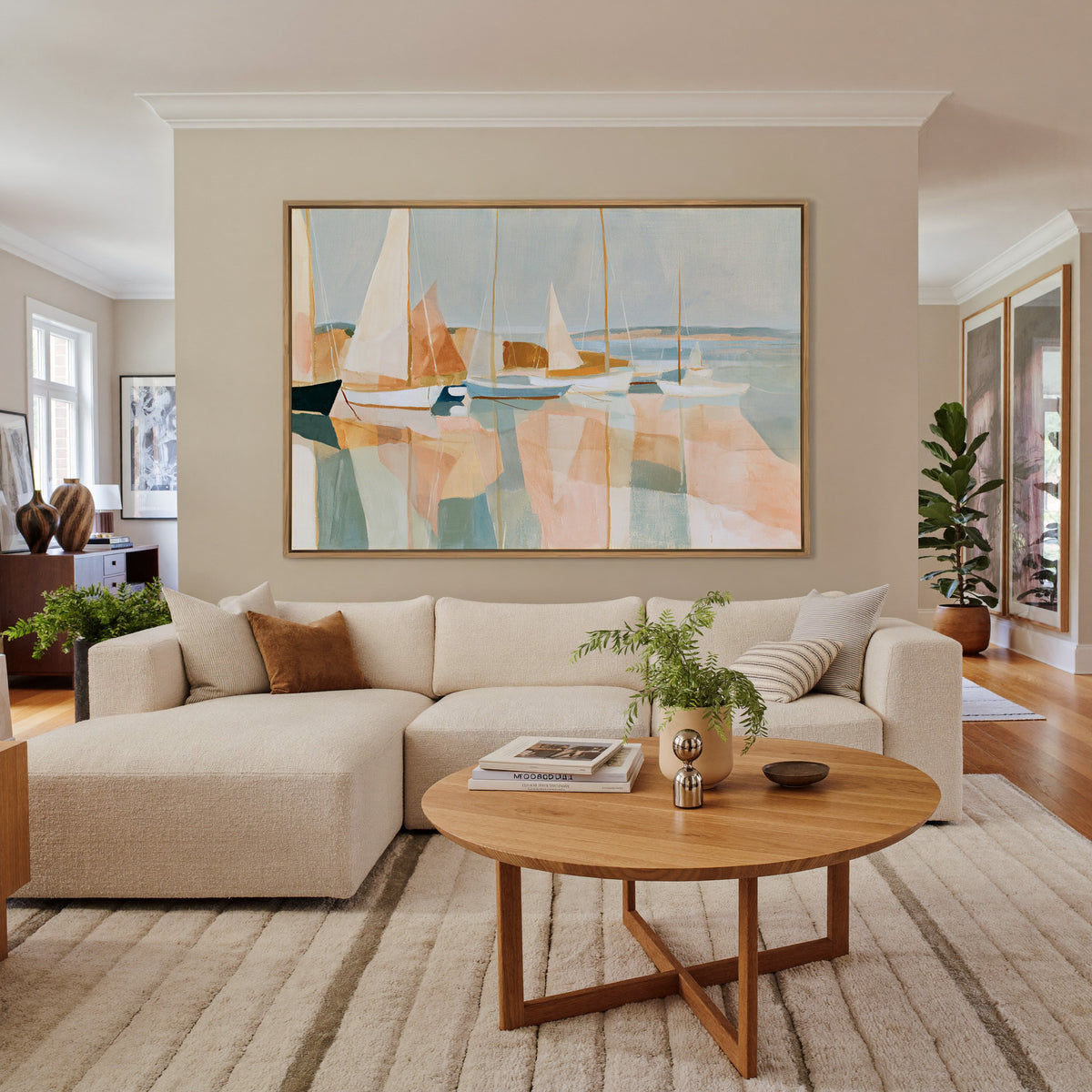 soft harbor with sailboats and pale reflections canvas wall art in an oak frame in a living room