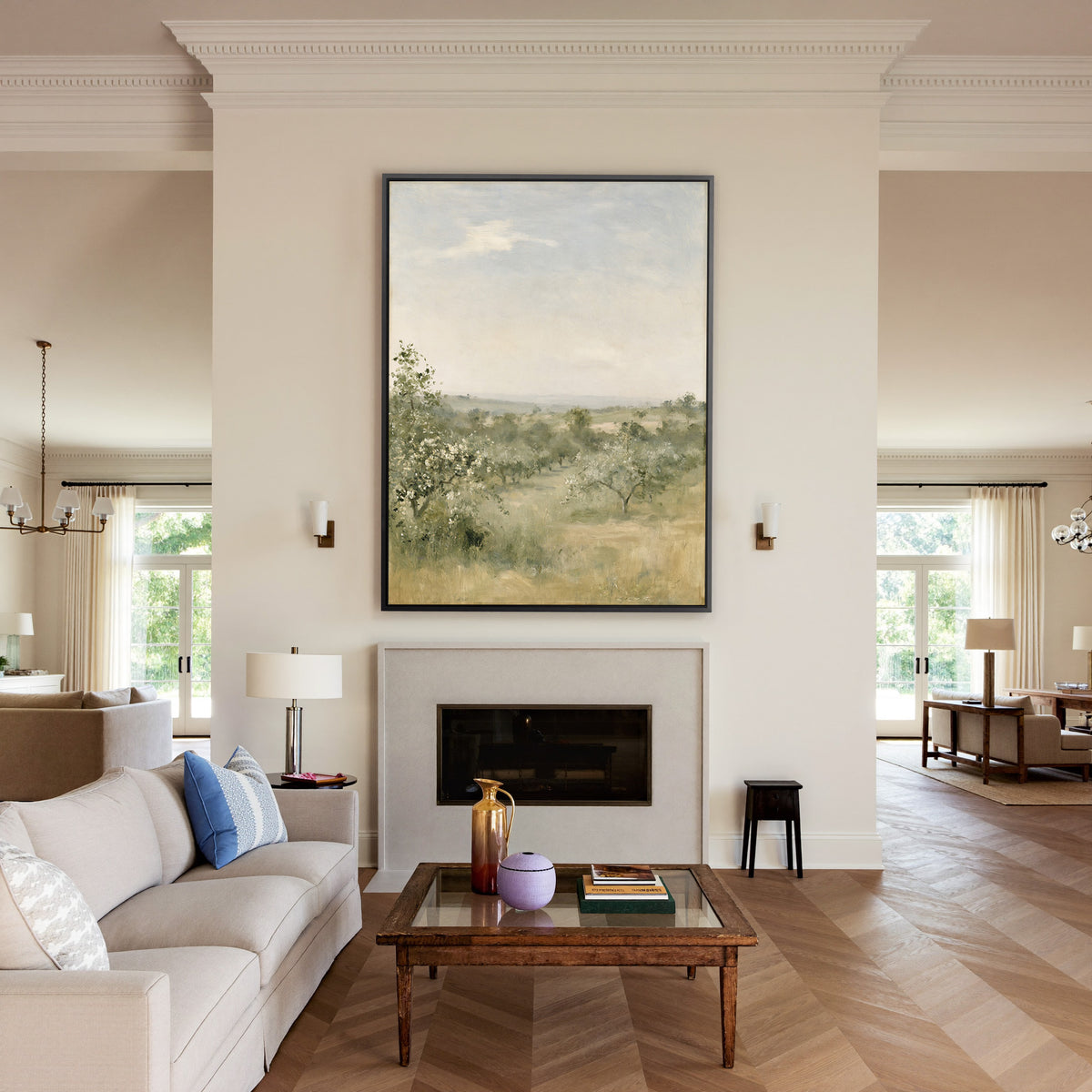 late summer orchard with uneven rows of small canvas wall art in a black frame above a mantel