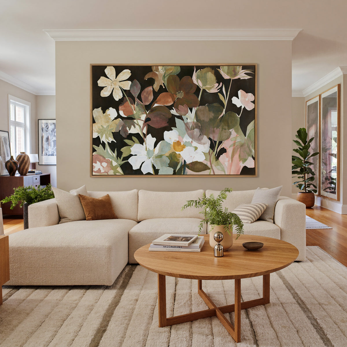wild meadow flowers on a dark ground canvas wall art in an oak frame in a living room