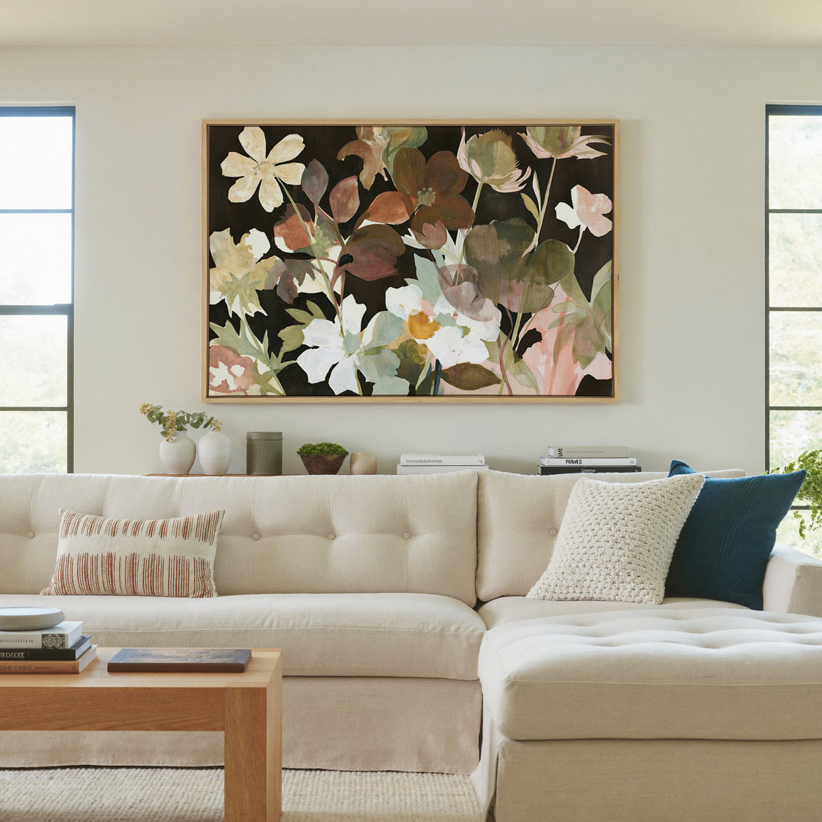 wild meadow flowers on a dark ground canvas wall art in a natural wood frame in a living room