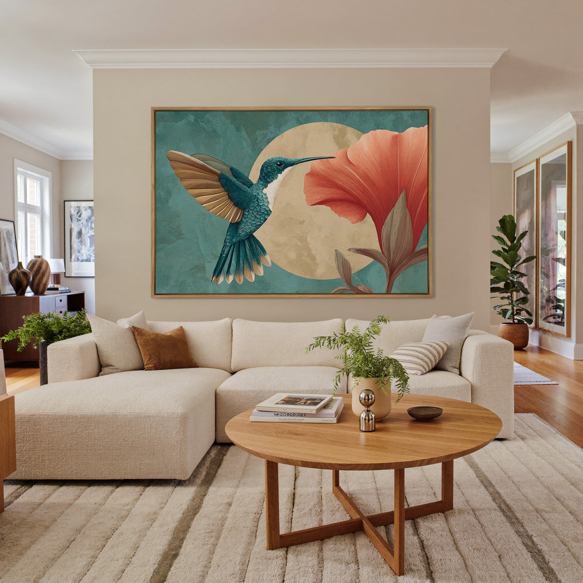 teal hummingbird beside an oversized coral canvas wall art in an oak finish floater frame in a living room