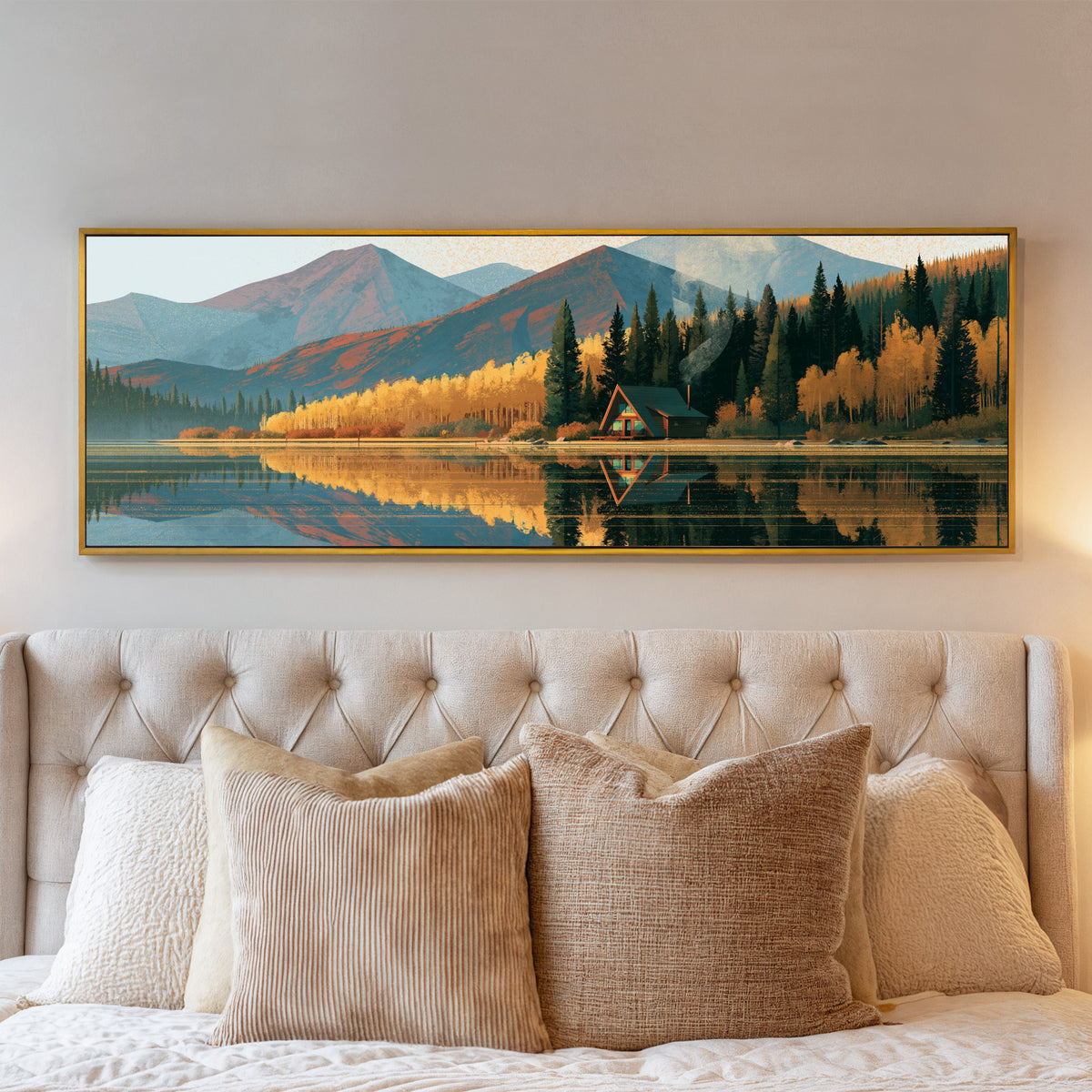 lakeside a frame cabin beneath blue mountains canvas wall art in a gold floater frame above a bed