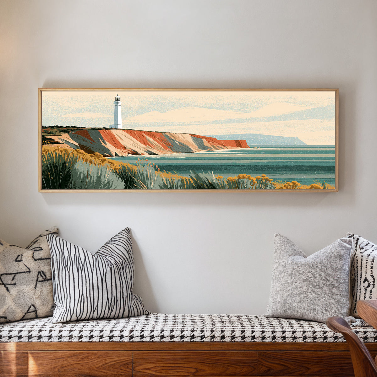 white lighthouse above terracotta cliffs and a canvas wall art in a natural floater frame in a living room