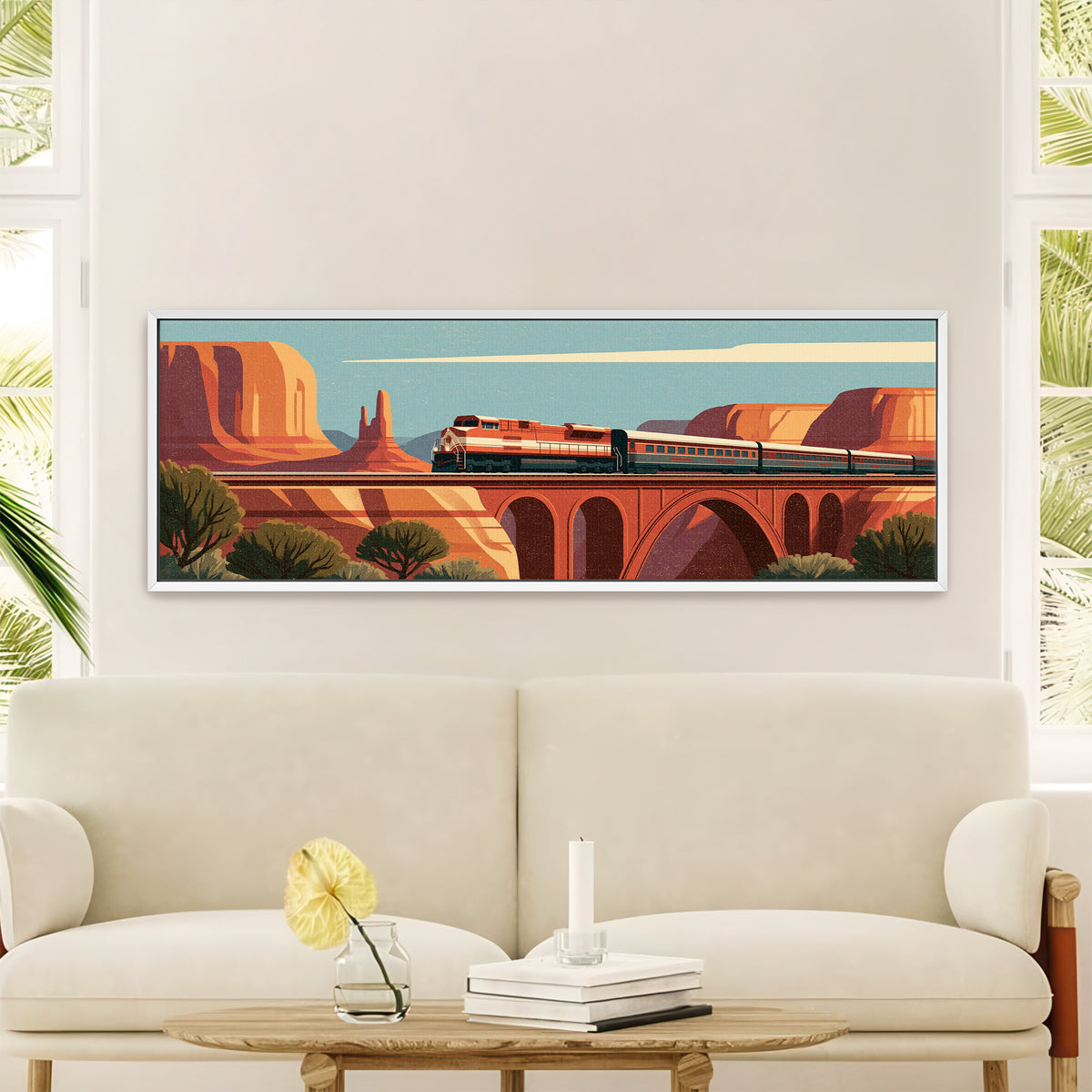 red and cream passenger train crossing an canvas wall art in a white floater frame in a styled room setting