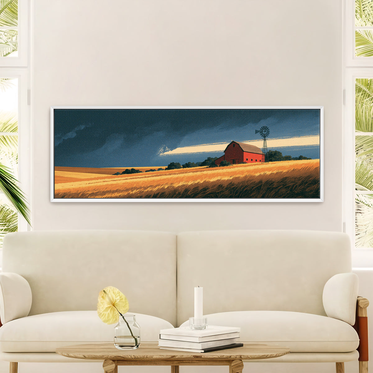 red barn and windmill above golden fields canvas wall art in a white floater frame in a styled room setting