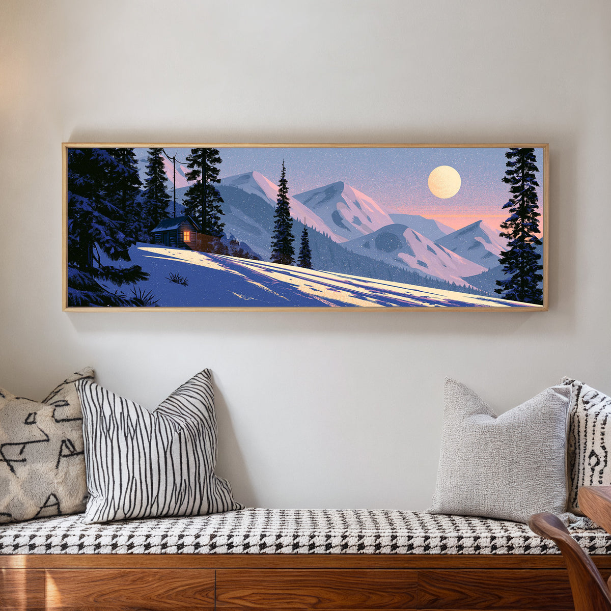 snowbound cabin beneath pink mountain ridges canvas wall art in a natural floater frame in a living room