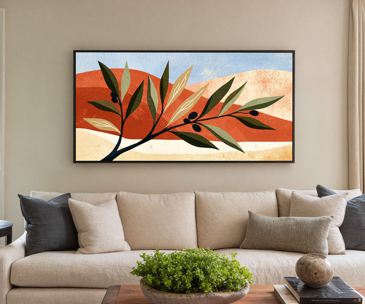 olive branch against terracotta canvas wall art in a black floater frame in a styled room setting