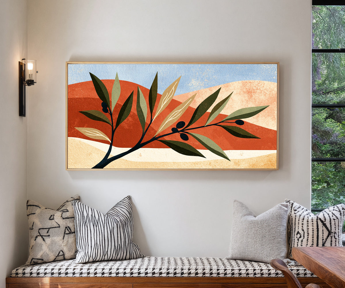 olive branch against terracotta curves and pale canvas wall art in a natural floater frame in a living room