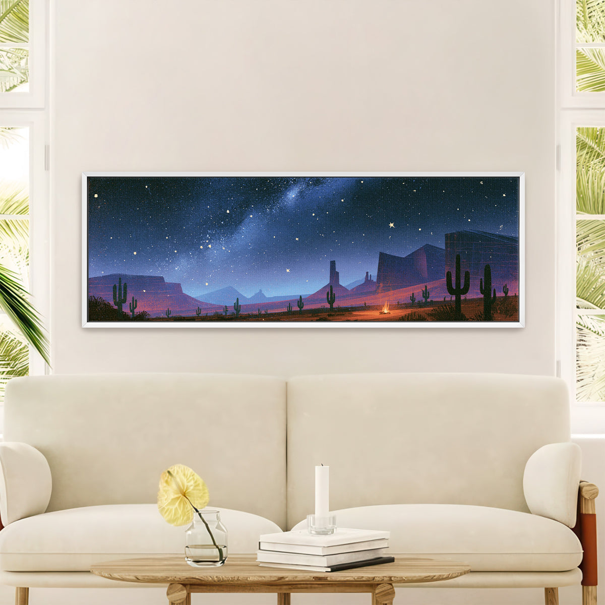 star filled blue sky above desert canvas wall art in a white floater frame in a styled room setting