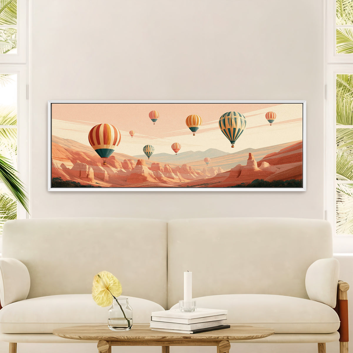 striped hot air balloons above a terracotta canvas wall art in a white floater frame in a styled room setting