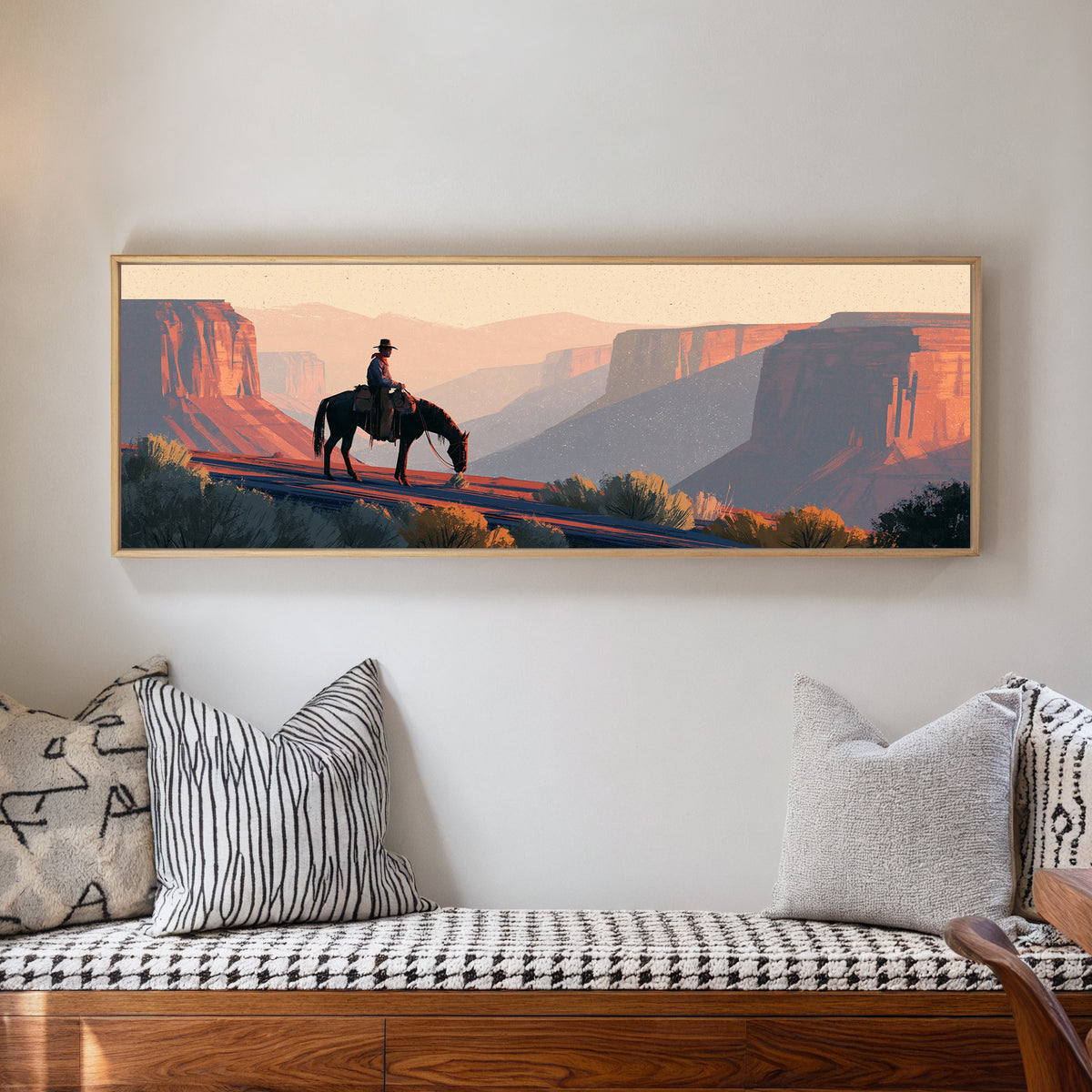 lone mounted cowboy above terracotta canyon canvas wall art in a natural floater frame in a living room