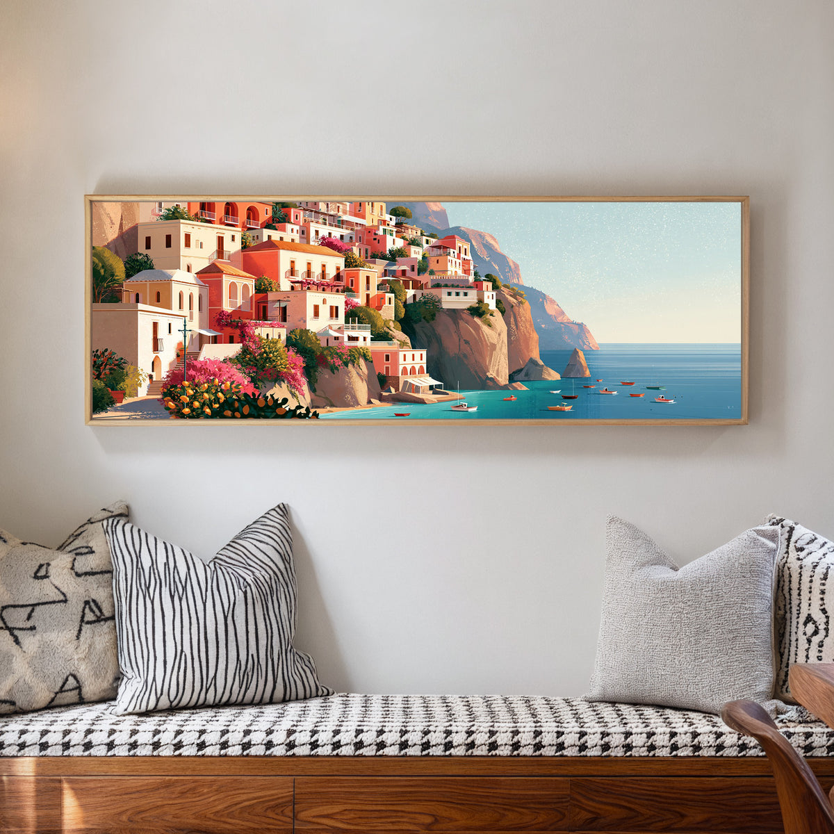 coral cliffside houses above turquoise water canvas wall art in a natural floater frame in a living room