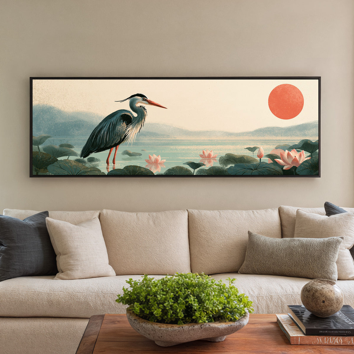 blue gray heron among pink lotus flowers canvas wall art in a black floater frame in a styled room setting