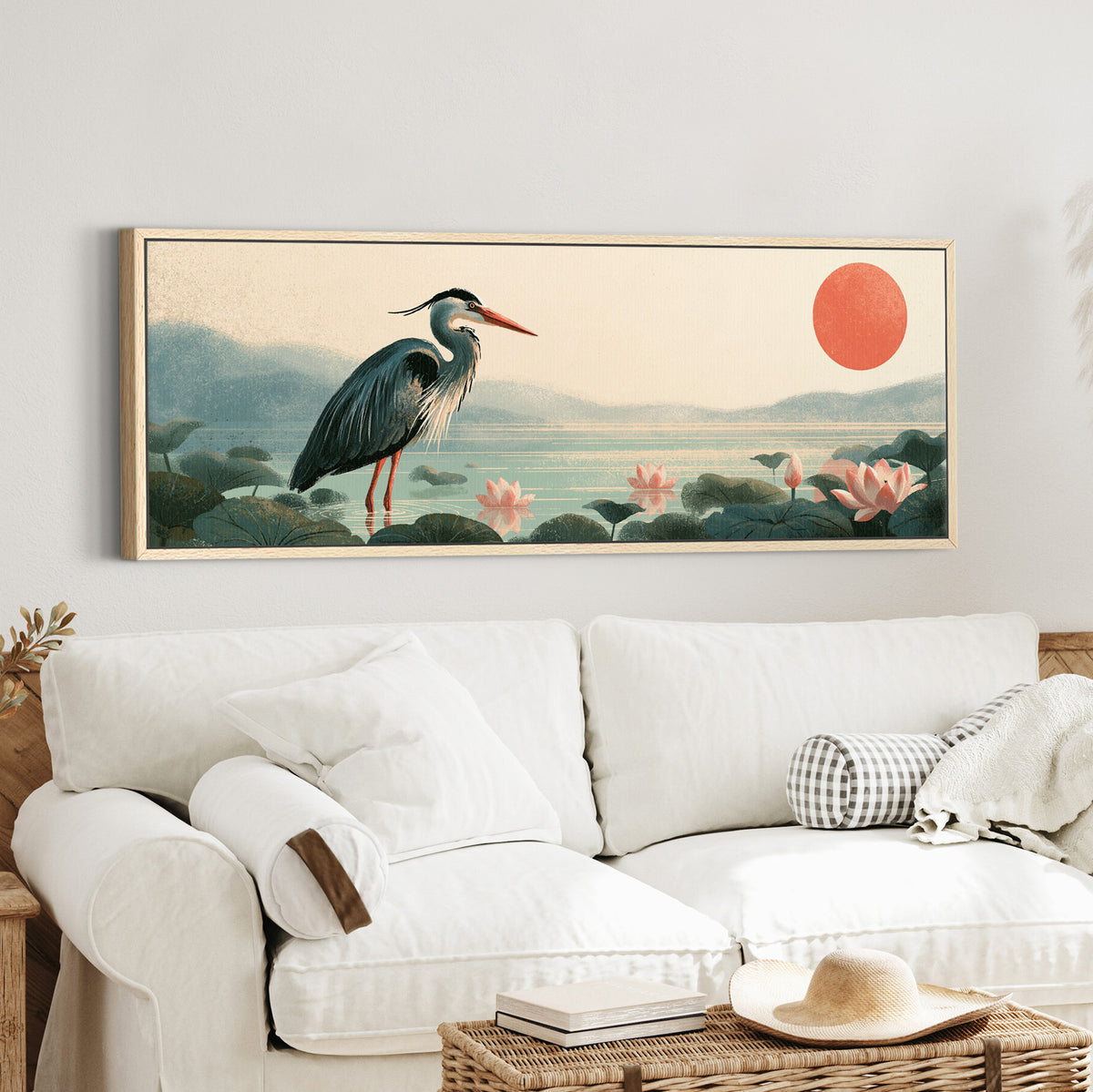 blue gray heron among pink lotus canvas wall art in an oak finish floater frame in a styled room setting