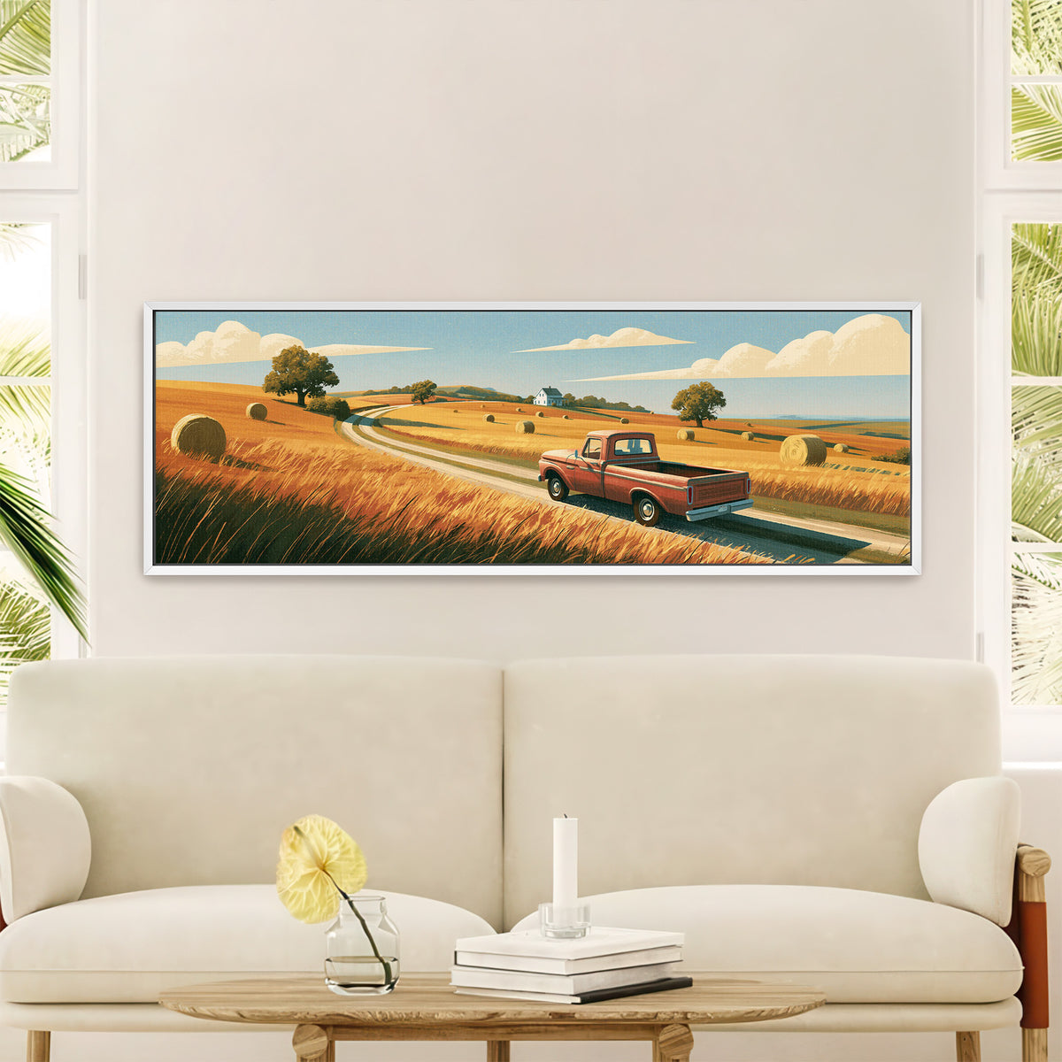 red pickup on a winding road through golden canvas wall art in a white floater frame in a styled room setting
