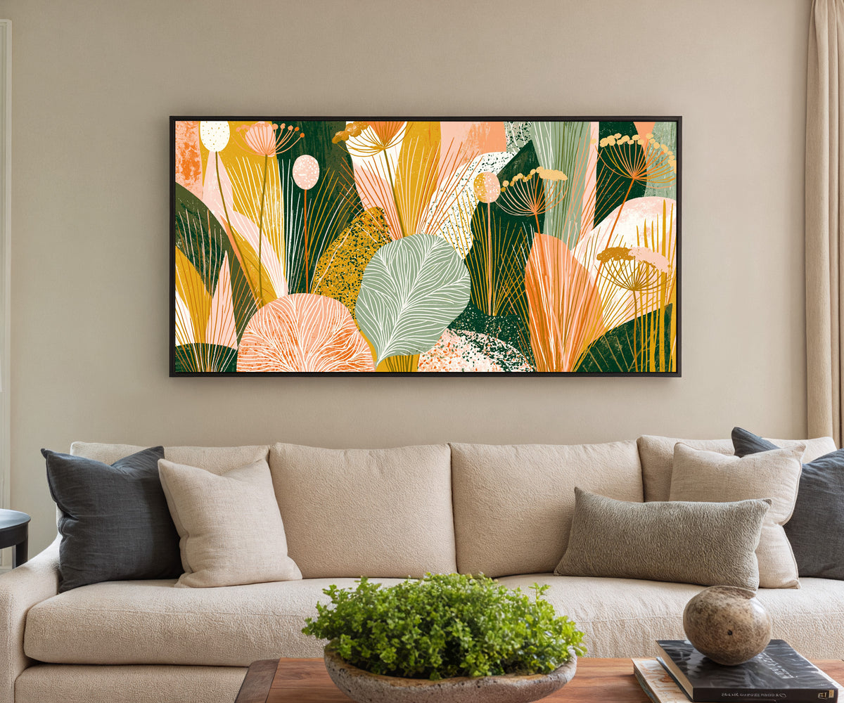 coral and green leaves with fine canvas wall art in a black floater frame in a styled room setting