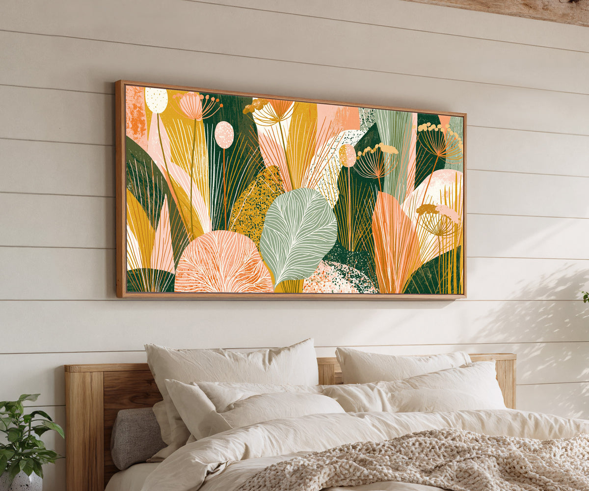 coral and green leaves with fine veins and fan canvas wall art in an oak finish floater frame above a bed