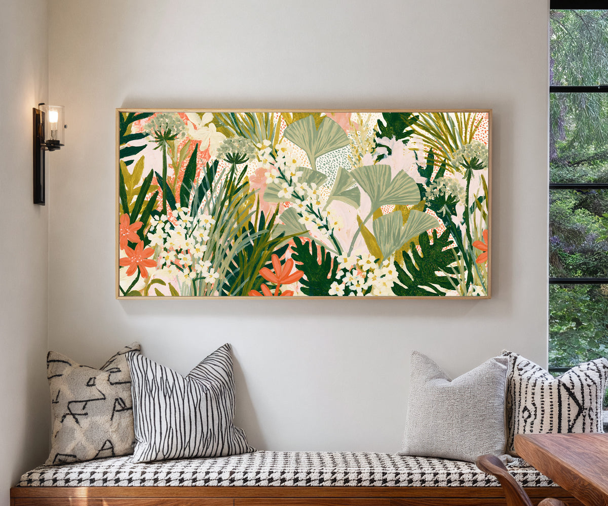 sage fan shaped leaves and white flowers over canvas wall art in a natural floater frame in a living room