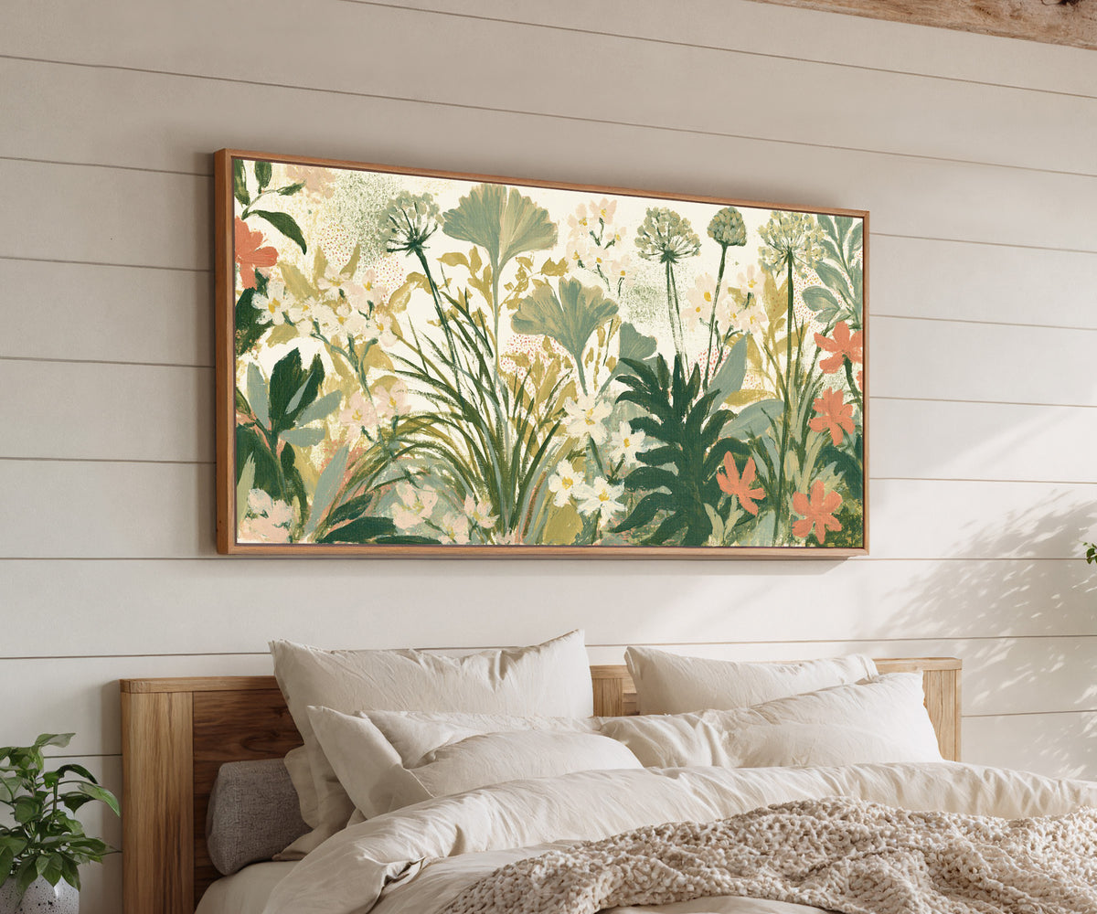 cream ground foliage with sage fans, white canvas wall art in an oak finish floater frame above a bed
