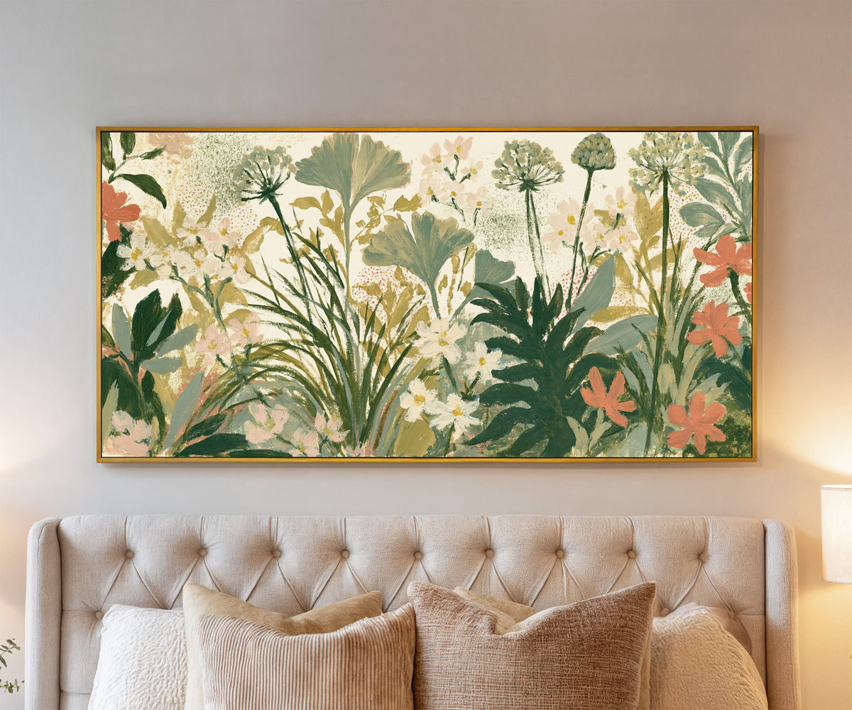 cream ground foliage with sage fans, white canvas wall art in a gold floater frame above a bed