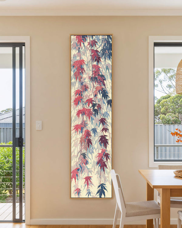 Vertical canvas wall art in interior setting.