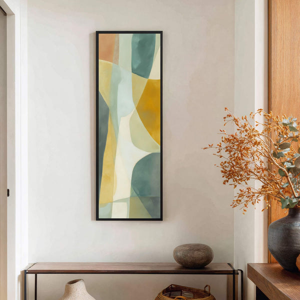 This vertical canvas print features an abstract design with a warm palette of ochre, teal, and cream hues. It is displayed on a light-colored wall above a wooden console table.