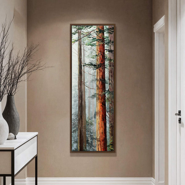 This vertical watercolor art print features redwood trees with a warm palette, set in a hallway with tan walls and a console table with vases.
