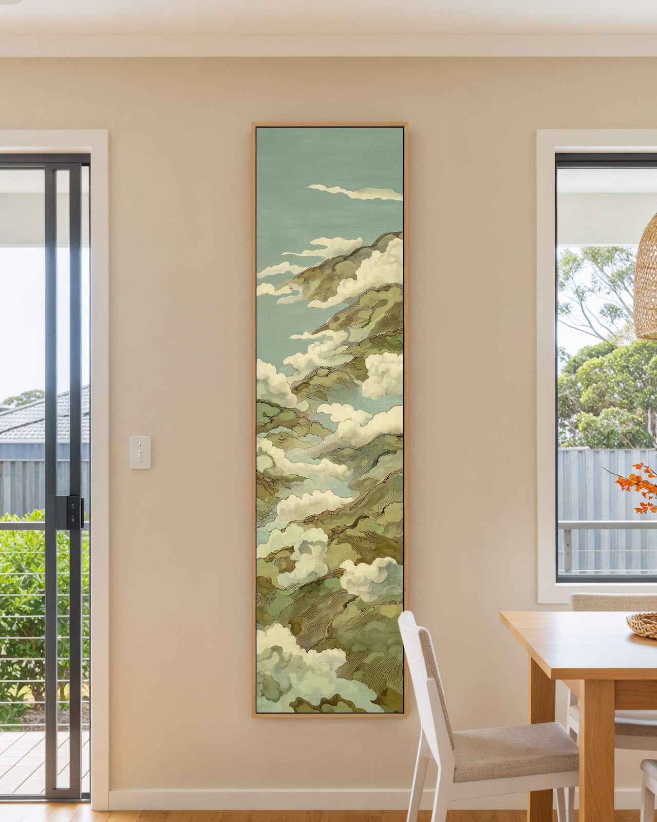 Vertical canvas wall art in interior setting.