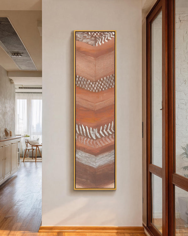 Vertical canvas wall art in interior setting.