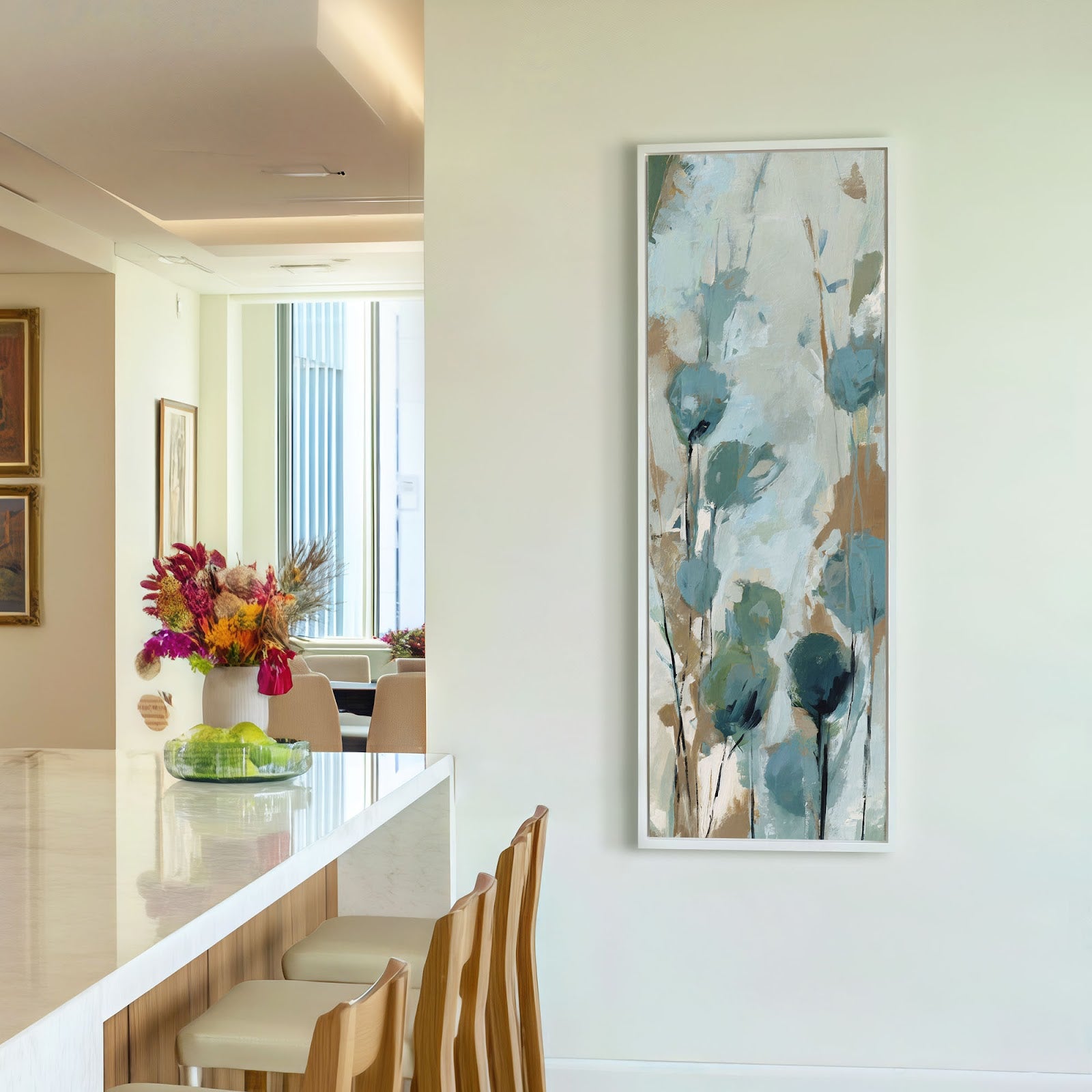 Teal wildflower botanical canvas print in white floating frame in bright modern kitchen with white cabinetry, airy contemporary vertical wall art