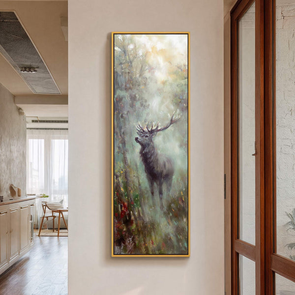 This vertical canvas wall art depicts a deer in a misty forest with a muted green and yellow palette in an impressionistic style, framed in gold.