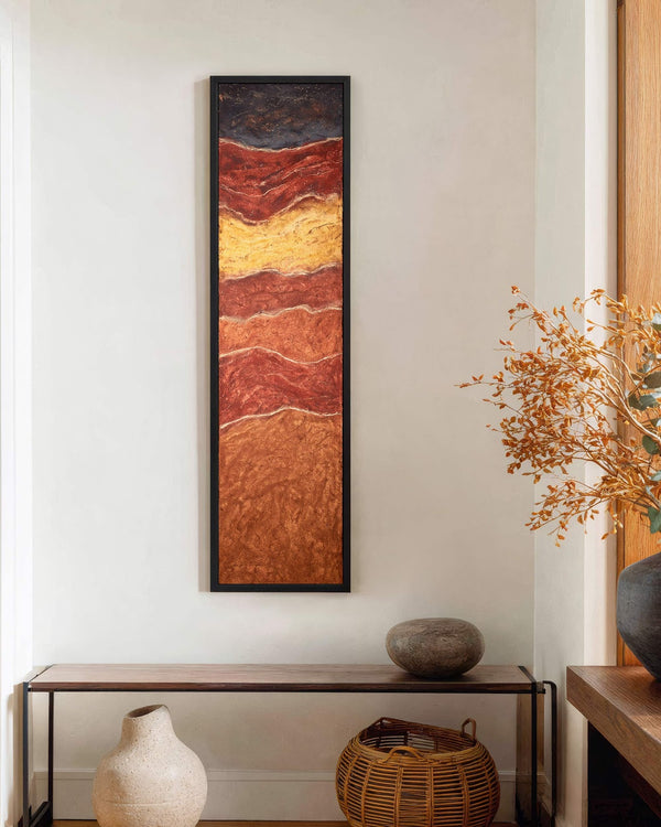 Vertical canvas wall art in interior setting.