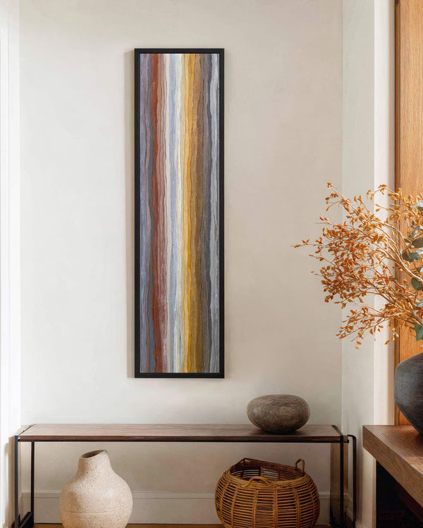 Vertical canvas wall art in interior setting.