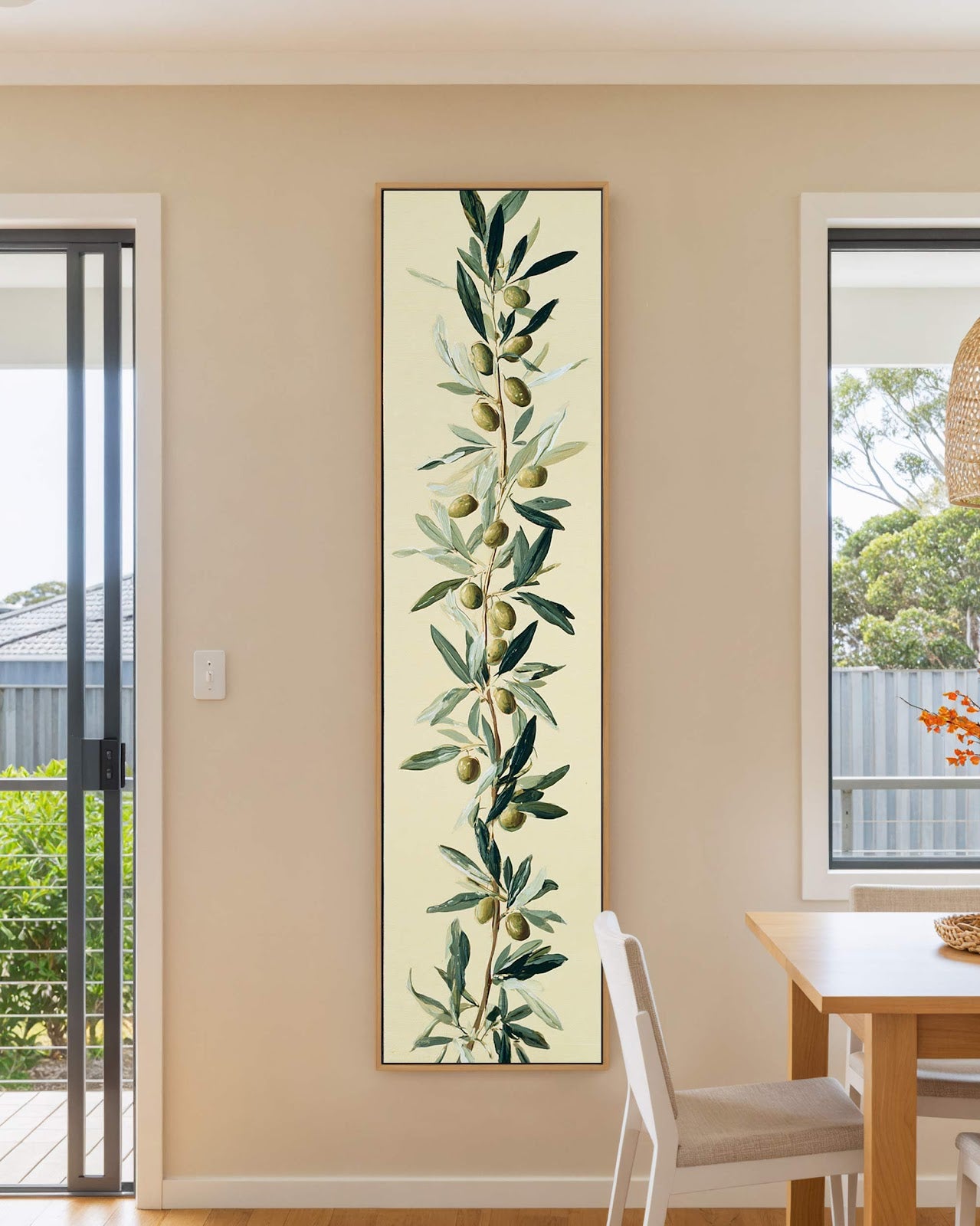 Vertical canvas wall art in interior setting.