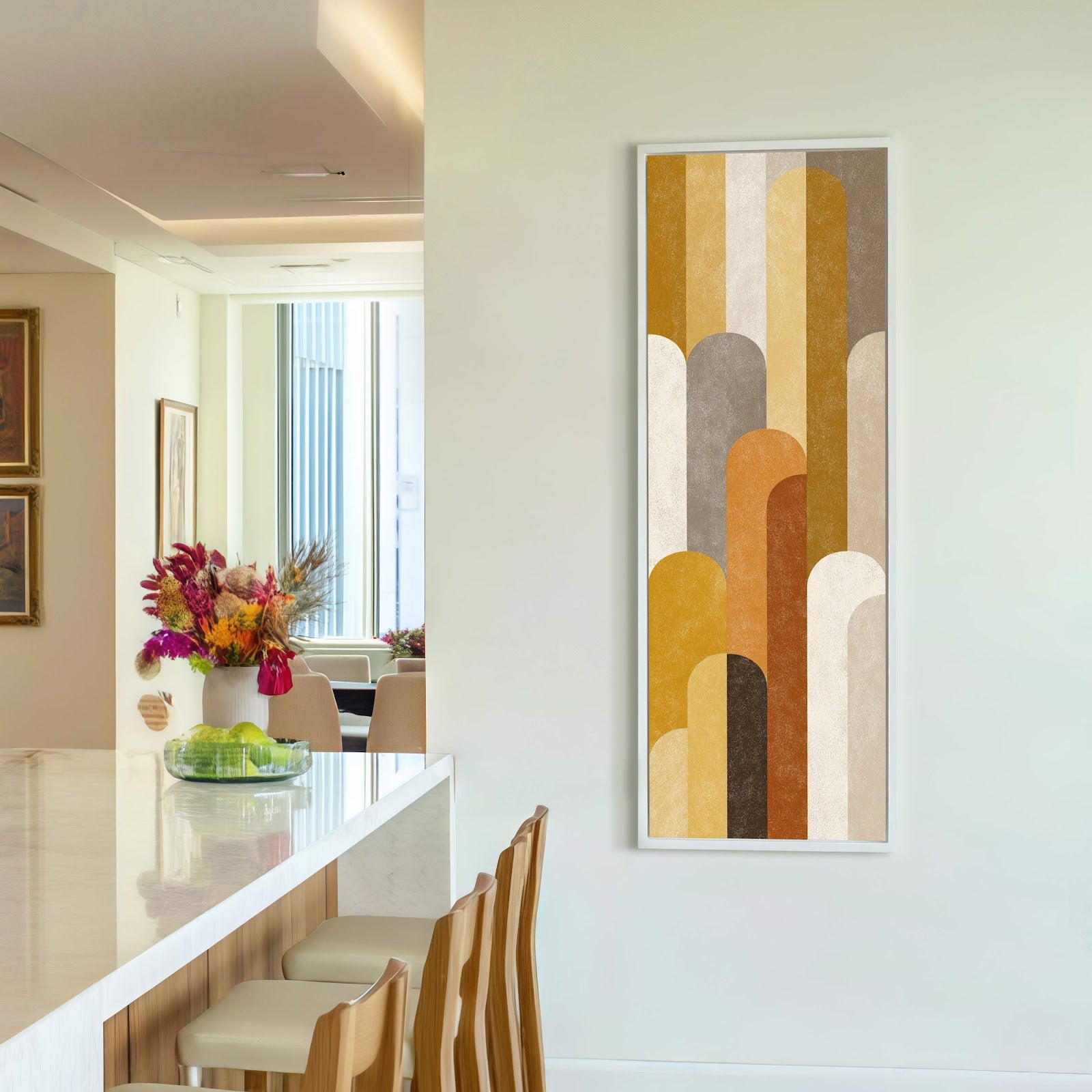 This vertical canvas wall art features an abstract geometric design with a palette of warm earth tones and a textured finish, displayed on a white wall in a modern interior.