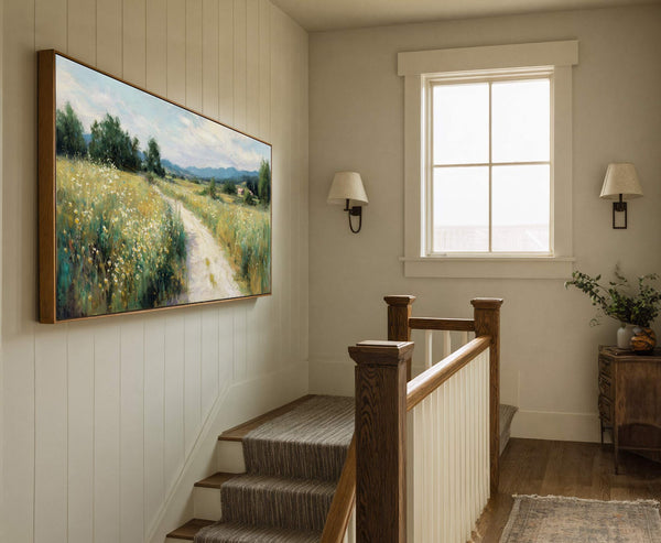 This horizontal canvas wall art depicts a vibrant, impressionistic landscape with a dirt path winding through a field of wildflowers and distant hills, framed in natural wood.