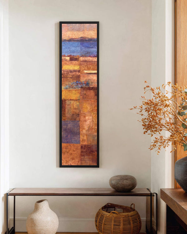 Vertical canvas wall art in interior setting.