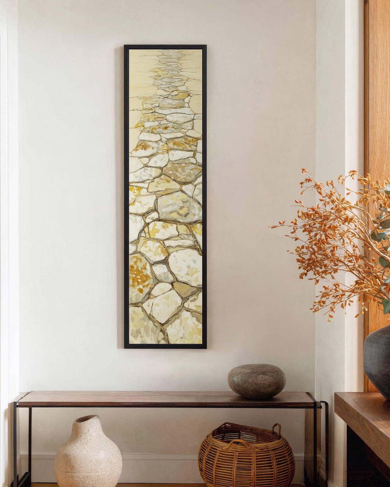 Vertical canvas wall art in interior setting.