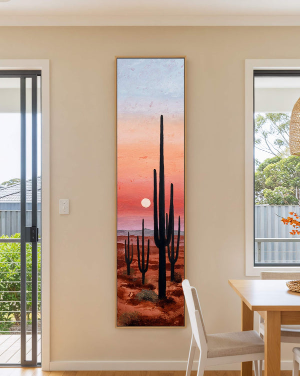 Vertical canvas wall art in interior setting.