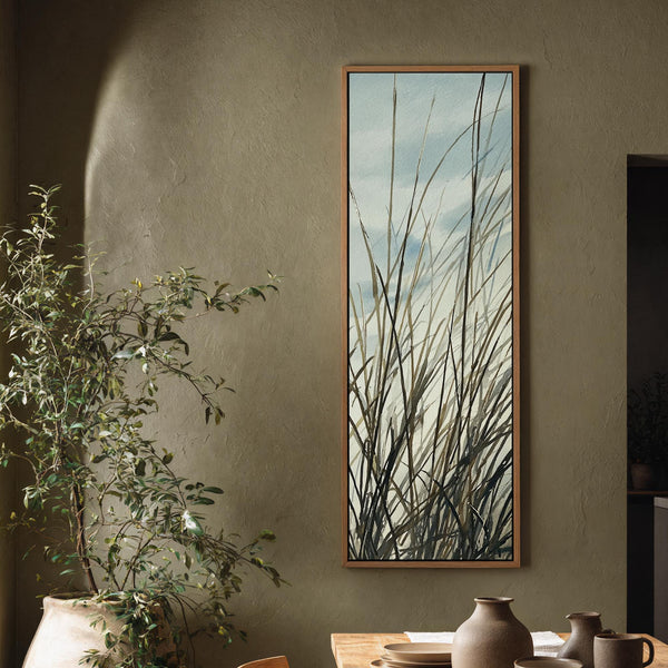 Vertical canvas wall art in interior setting.