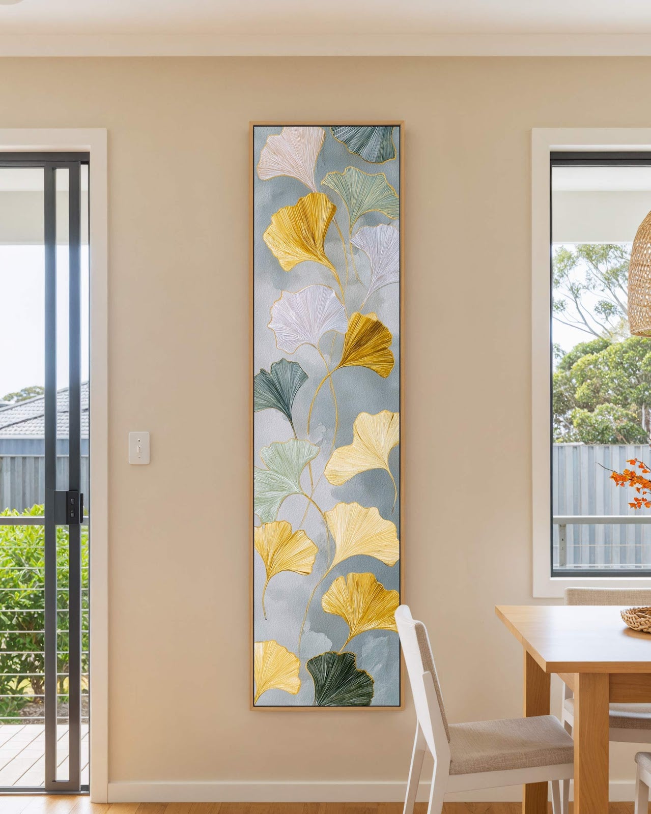 Vertical canvas wall art in interior setting.